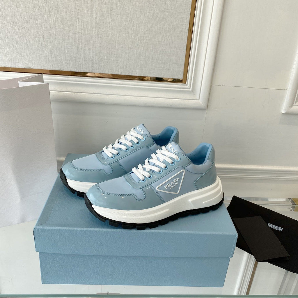 PRADA 25S THICK SOLE SNEAKER IN LIGHT BLUE CALFSKIN AND CANVAS
