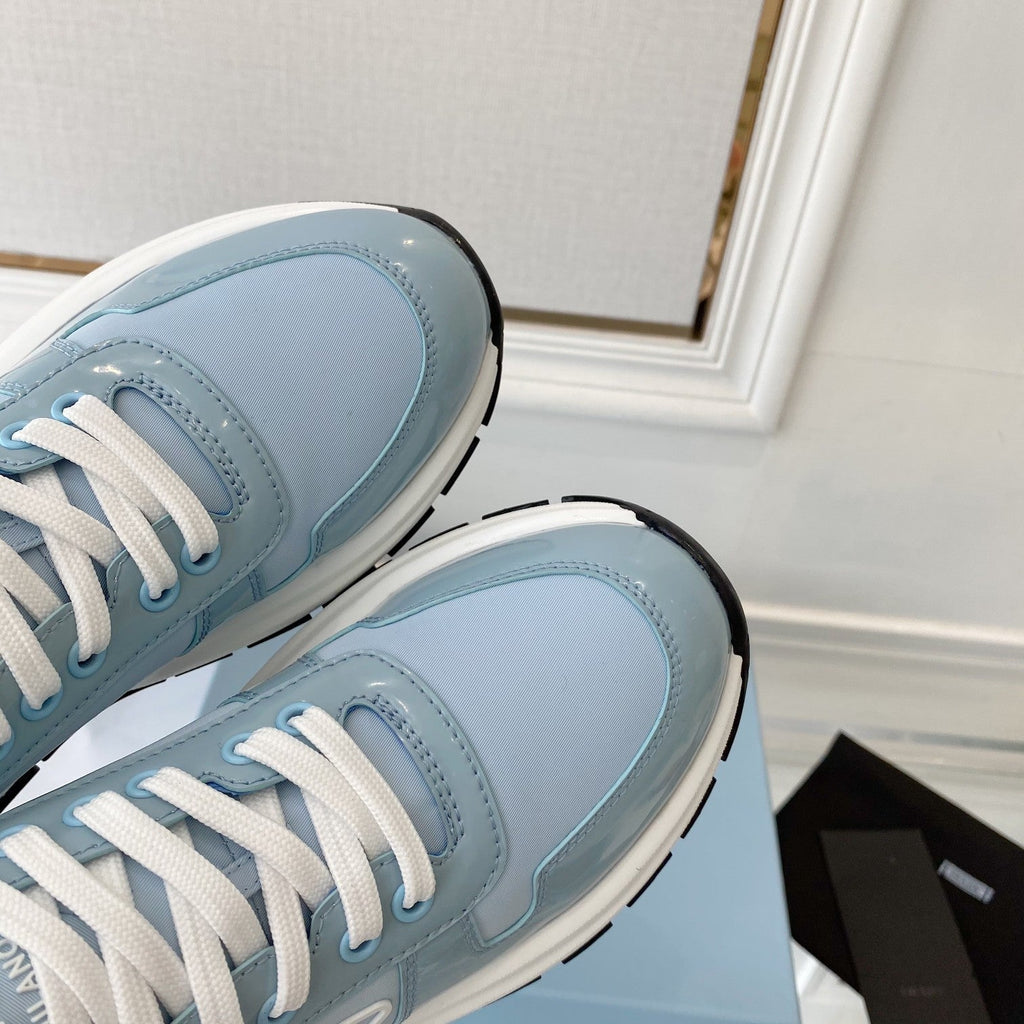PRADA 25S THICK SOLE SNEAKER IN LIGHT BLUE CALFSKIN AND CANVAS