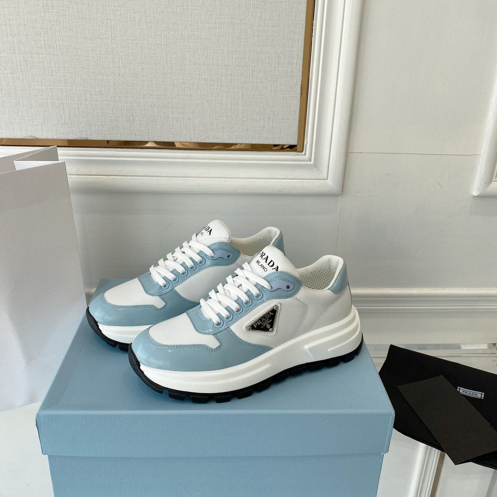 PRADA 25S THICK SOLE SNEAKER IN WHITE AND LIGHT BLUE CALFSKIN