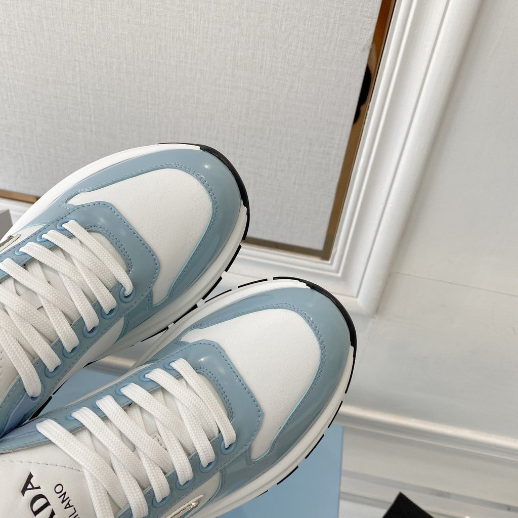 PRADA 25S THICK SOLE SNEAKER IN WHITE AND LIGHT BLUE CALFSKIN