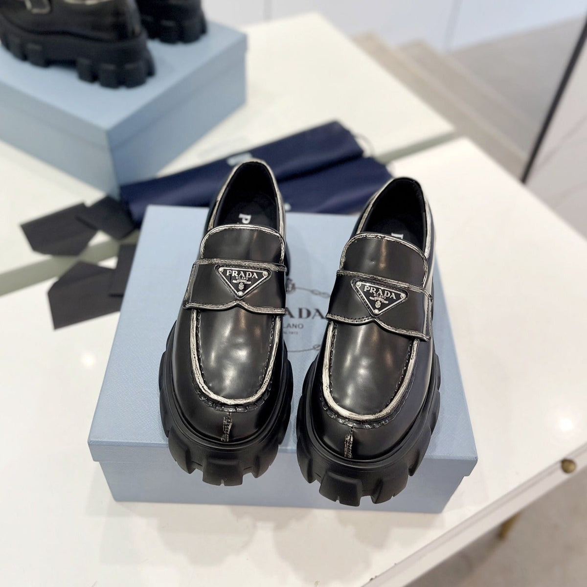 PRADA BRUSHED LEATHER MONOLITH LOAFERS BLACK-SILVER BORDER