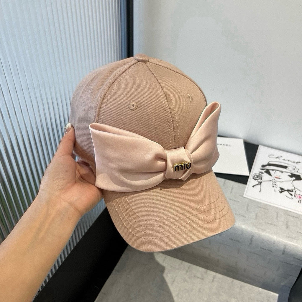 MM BASEBALL CAP IN BEIGE FABRIC WITH LARGE PINK BOW