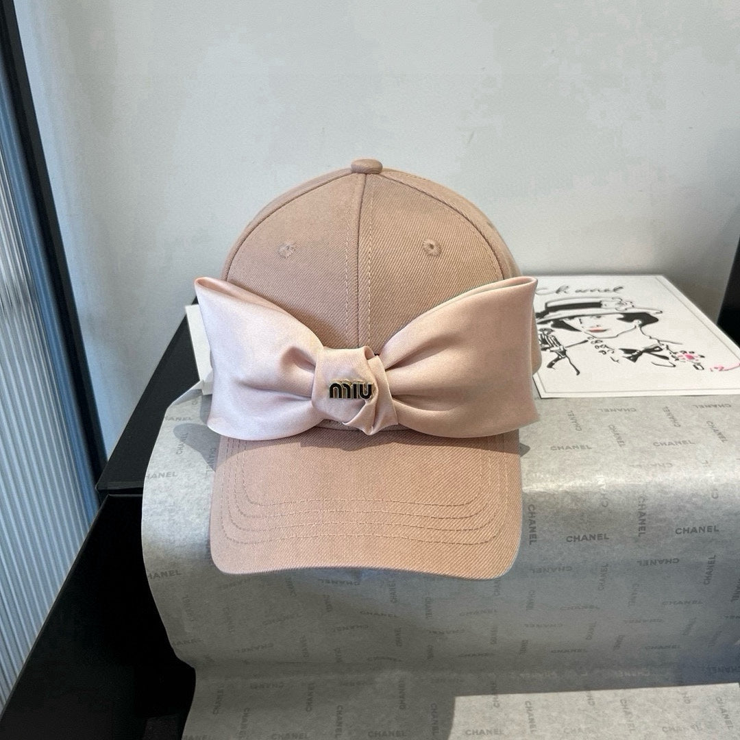 MM BASEBALL CAP IN BEIGE FABRIC WITH LARGE PINK BOW