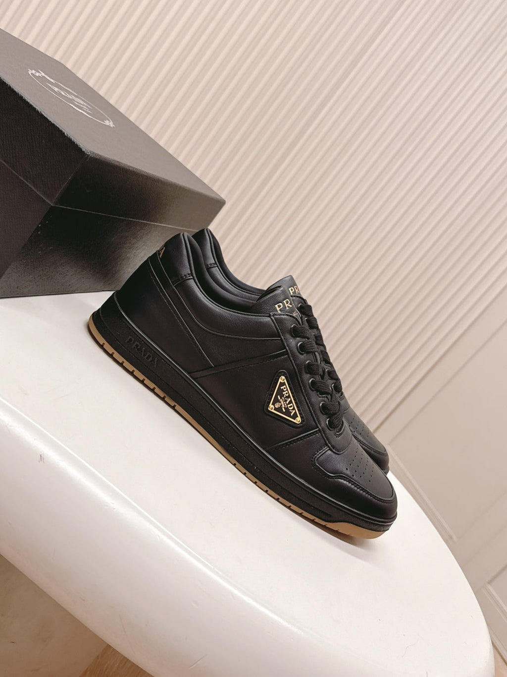 PRADA 25S DOWNTOWN SNEAKERS IN BLACK CALFSKIN