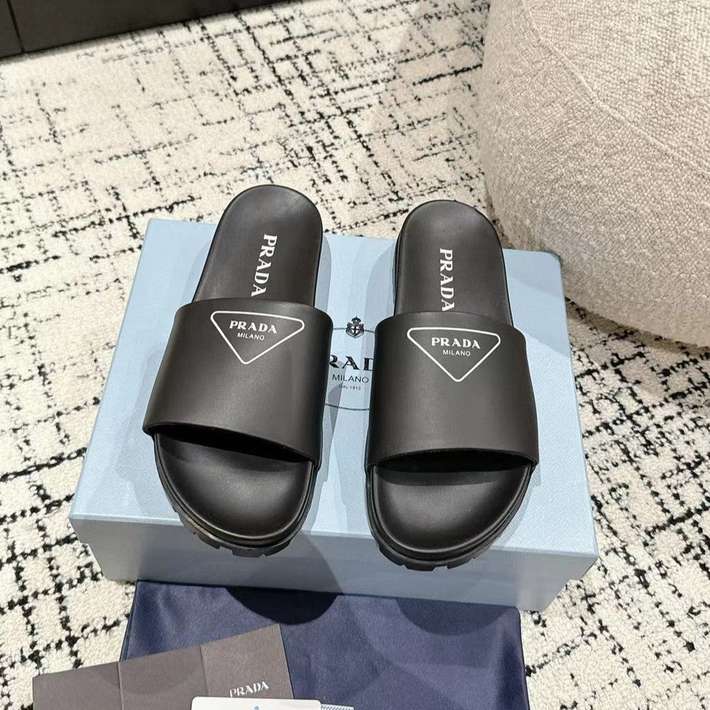 PRADA 25S RUBBER SLIDE IN BLACK CALFSKIN WITH LOGO