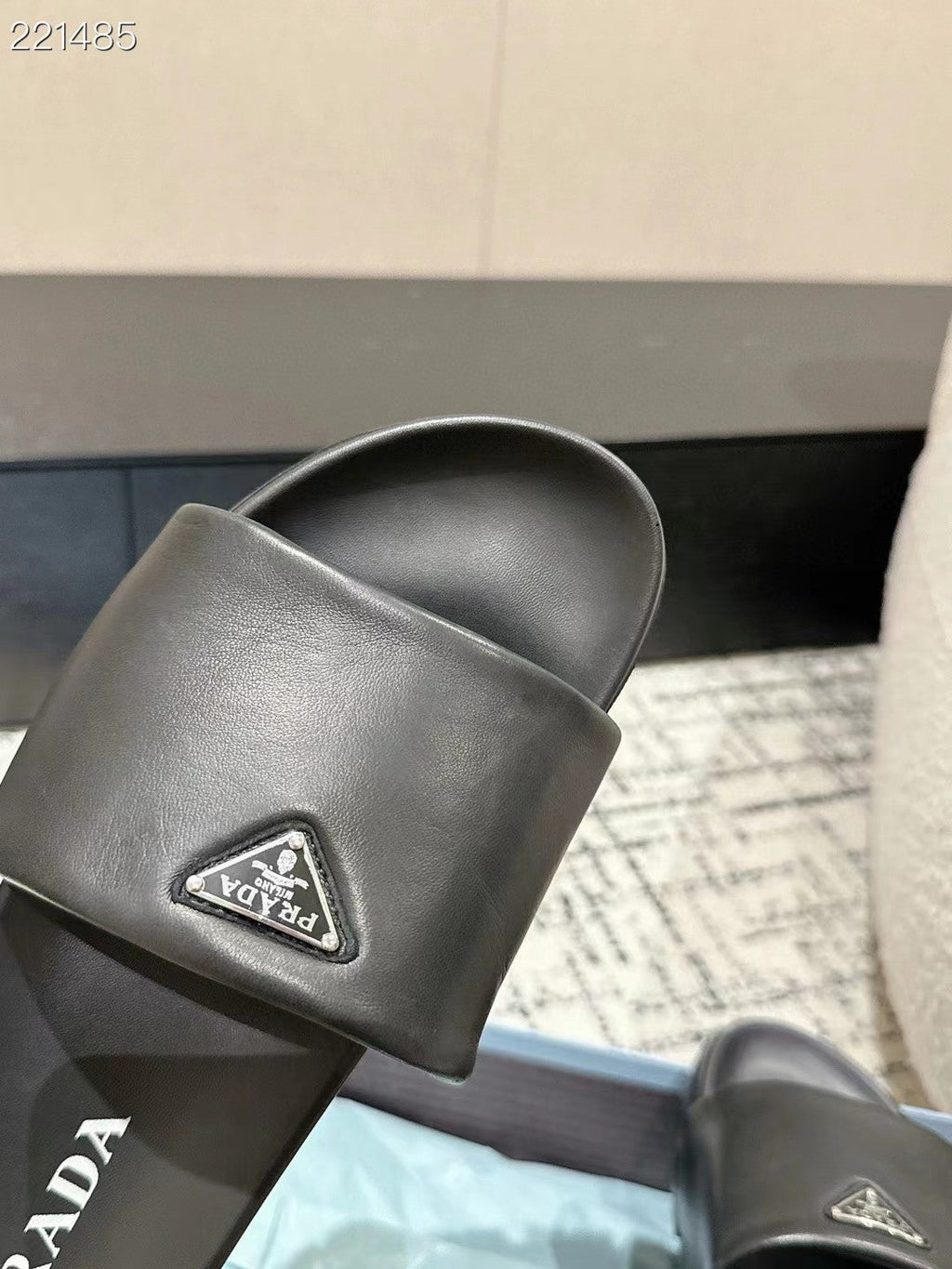 PRADA 25S PADDED SLIDES IN BLACK CALFSKIN WITH LOGO