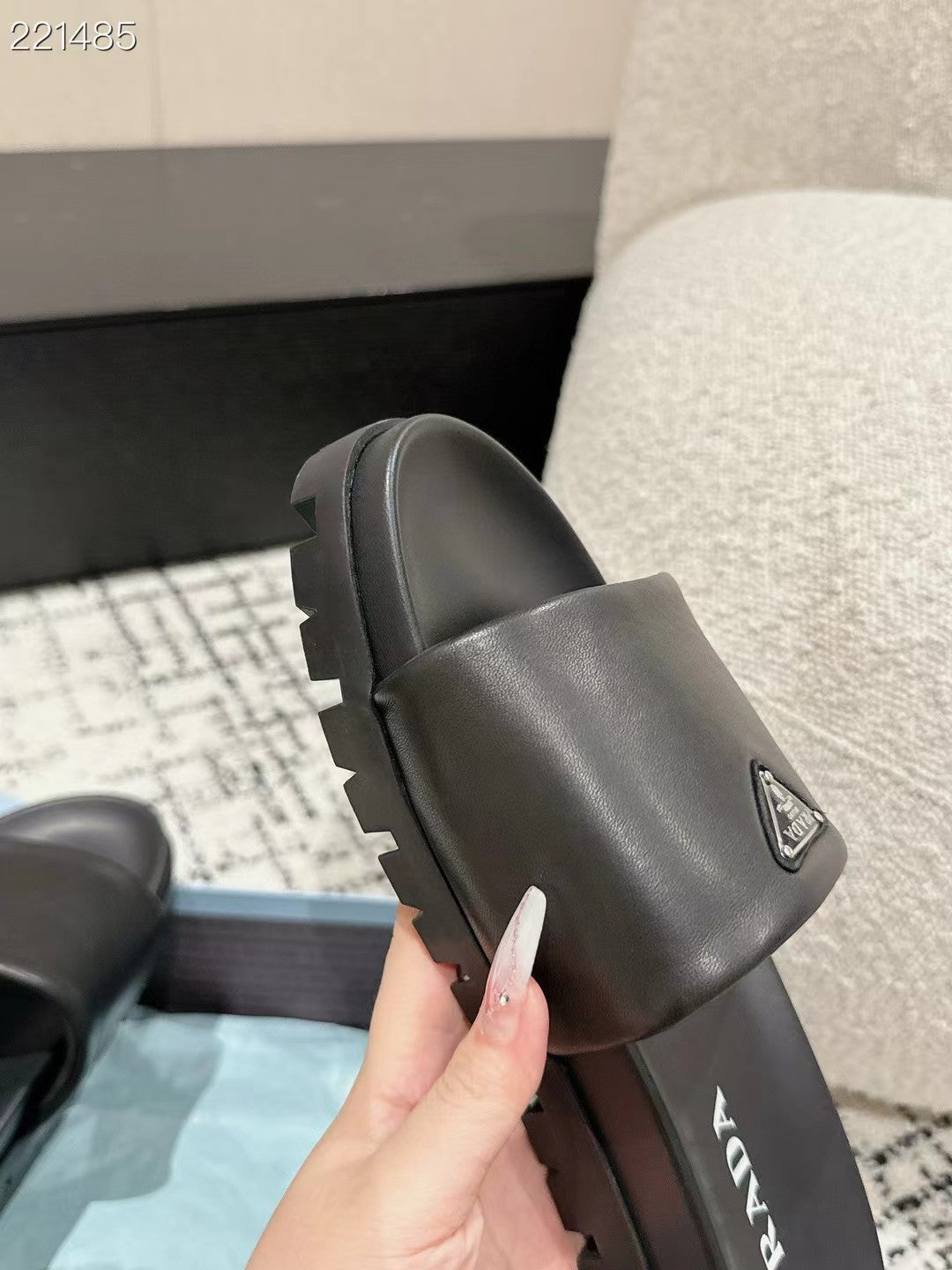 PRADA 25S PADDED SLIDES IN BLACK CALFSKIN WITH LOGO