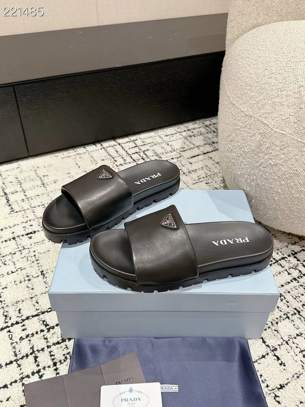 PRADA 25S PADDED SLIDES IN BLACK CALFSKIN WITH LOGO