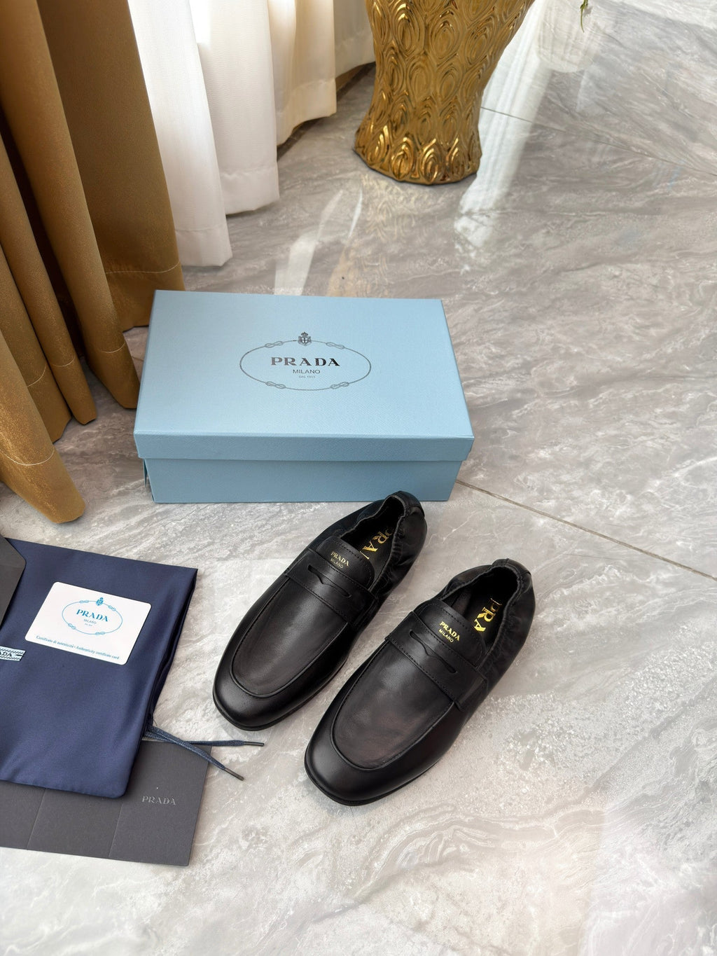 PRADA 25S LOAFERS IN BLACK CALFSKIN
