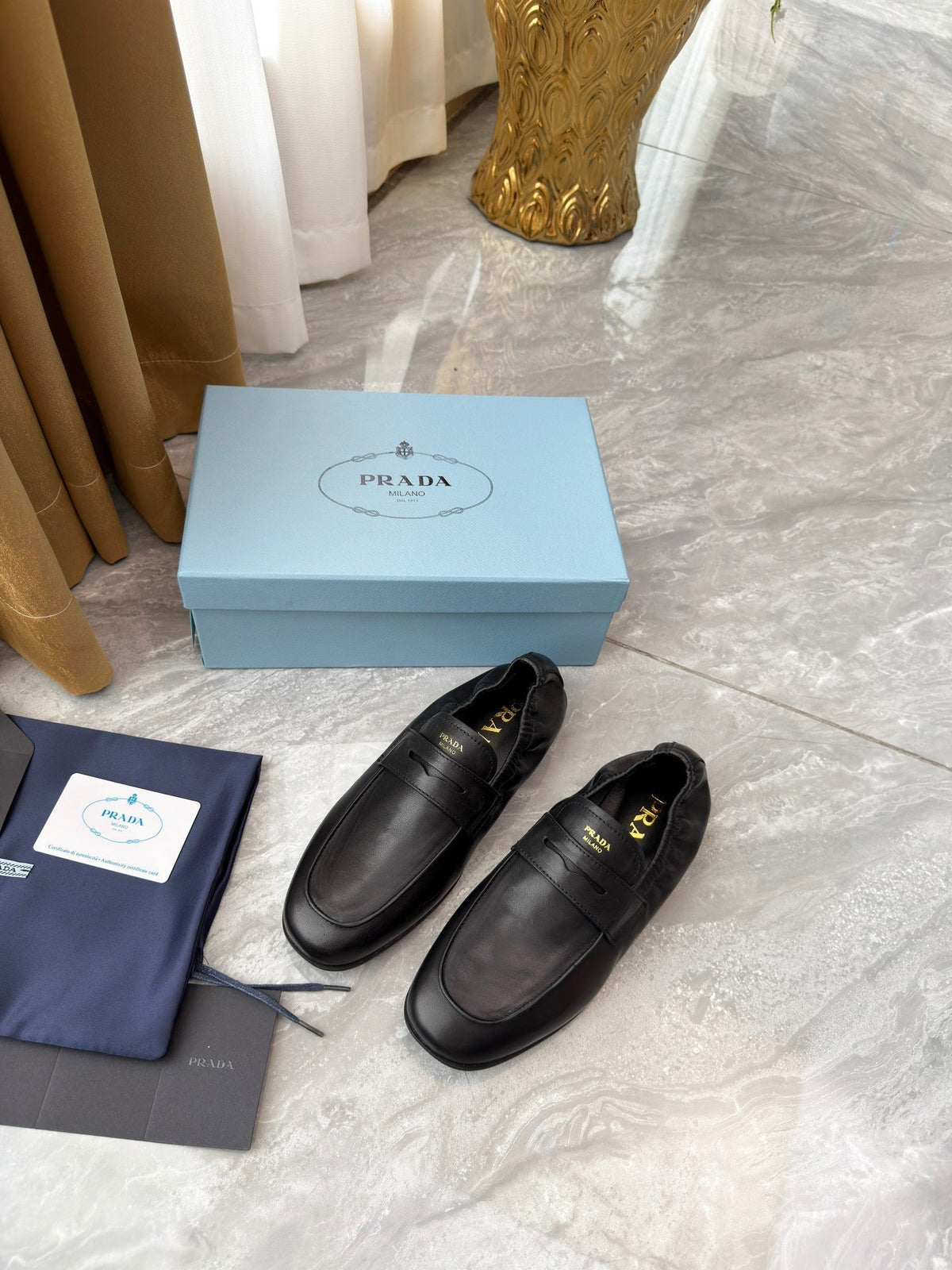 PRADA 25S LOAFERS IN BLACK CALFSKIN