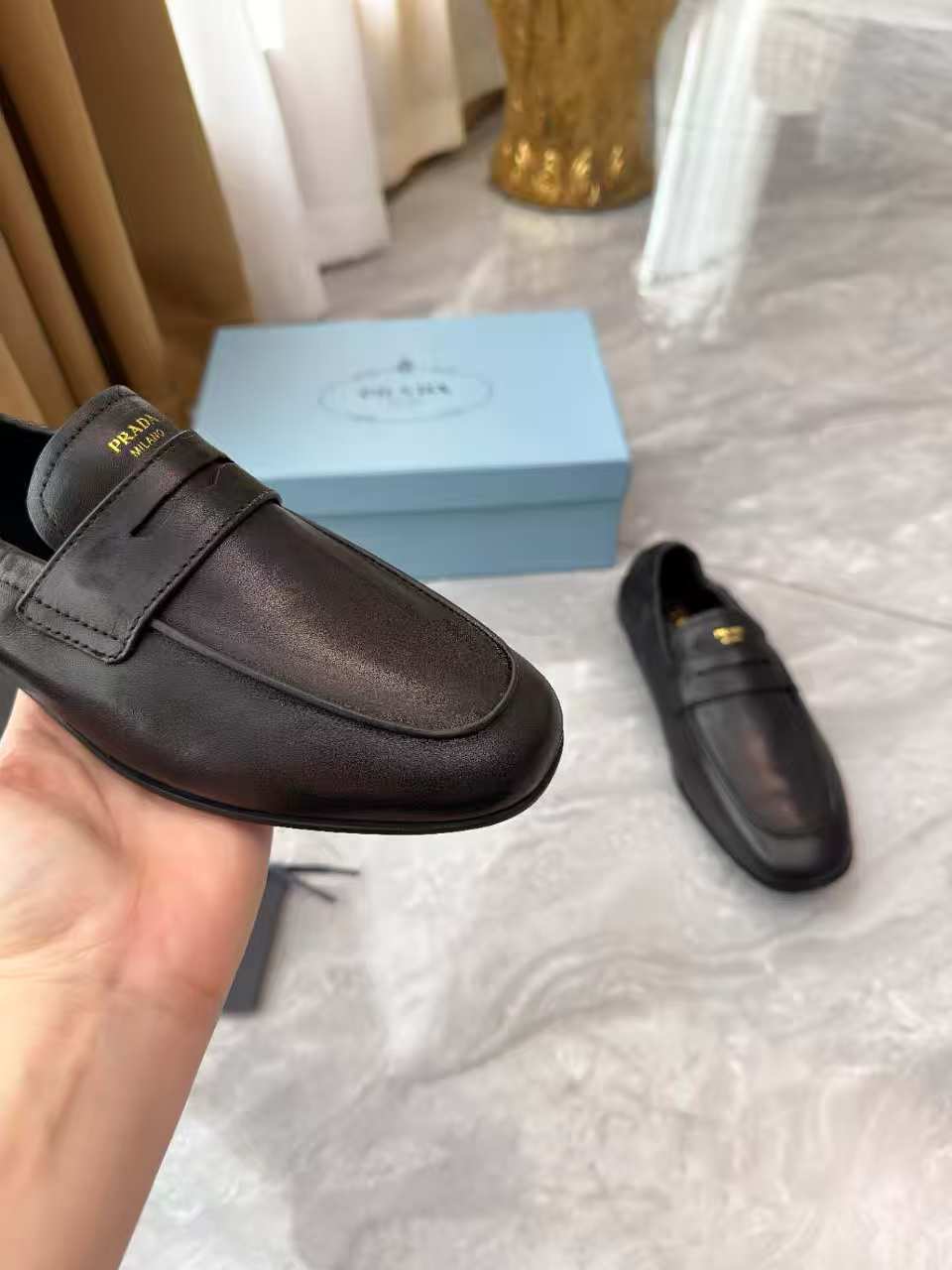 PRADA 25S LOAFERS IN BLACK CALFSKIN