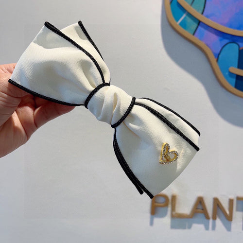 BOW HAIRPIN IN WHITE AND BLACK TRIM COTTON 406023