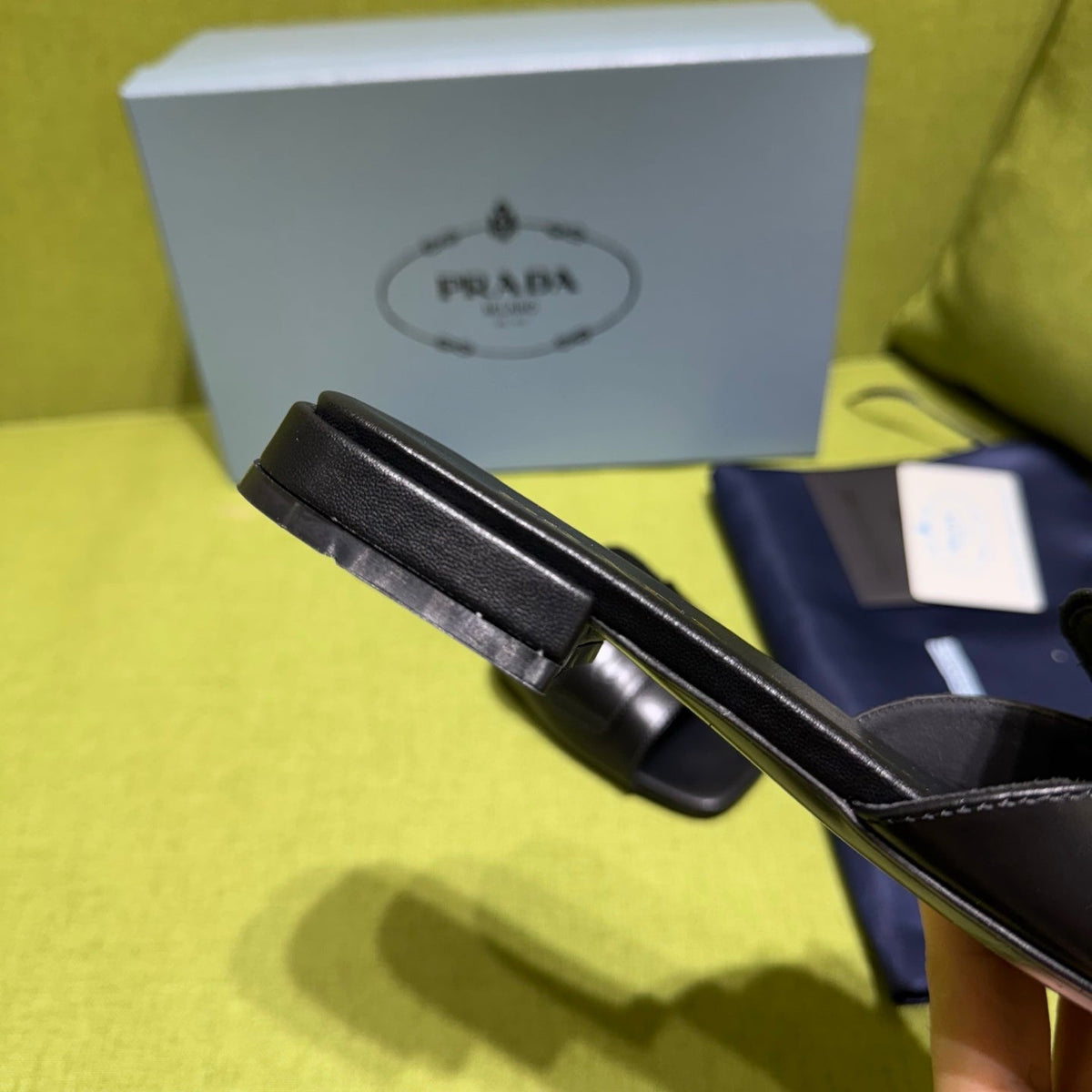 PRADA 25S SLIDES IN BLACK CALFSKIN