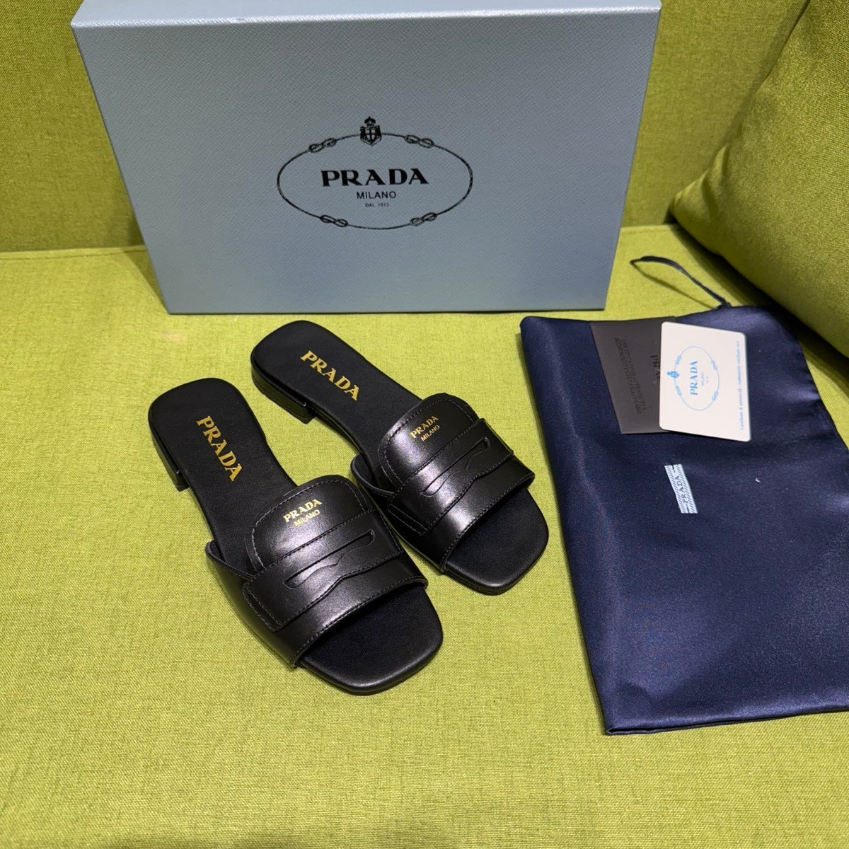 PRADA 25S SLIDES IN BLACK CALFSKIN