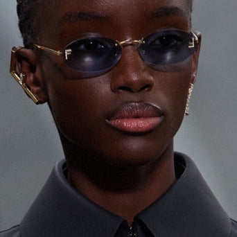 FIRST CRYSTAL RIMLESS OVAL FRAME SUNGLASSES 557152 IN METAL