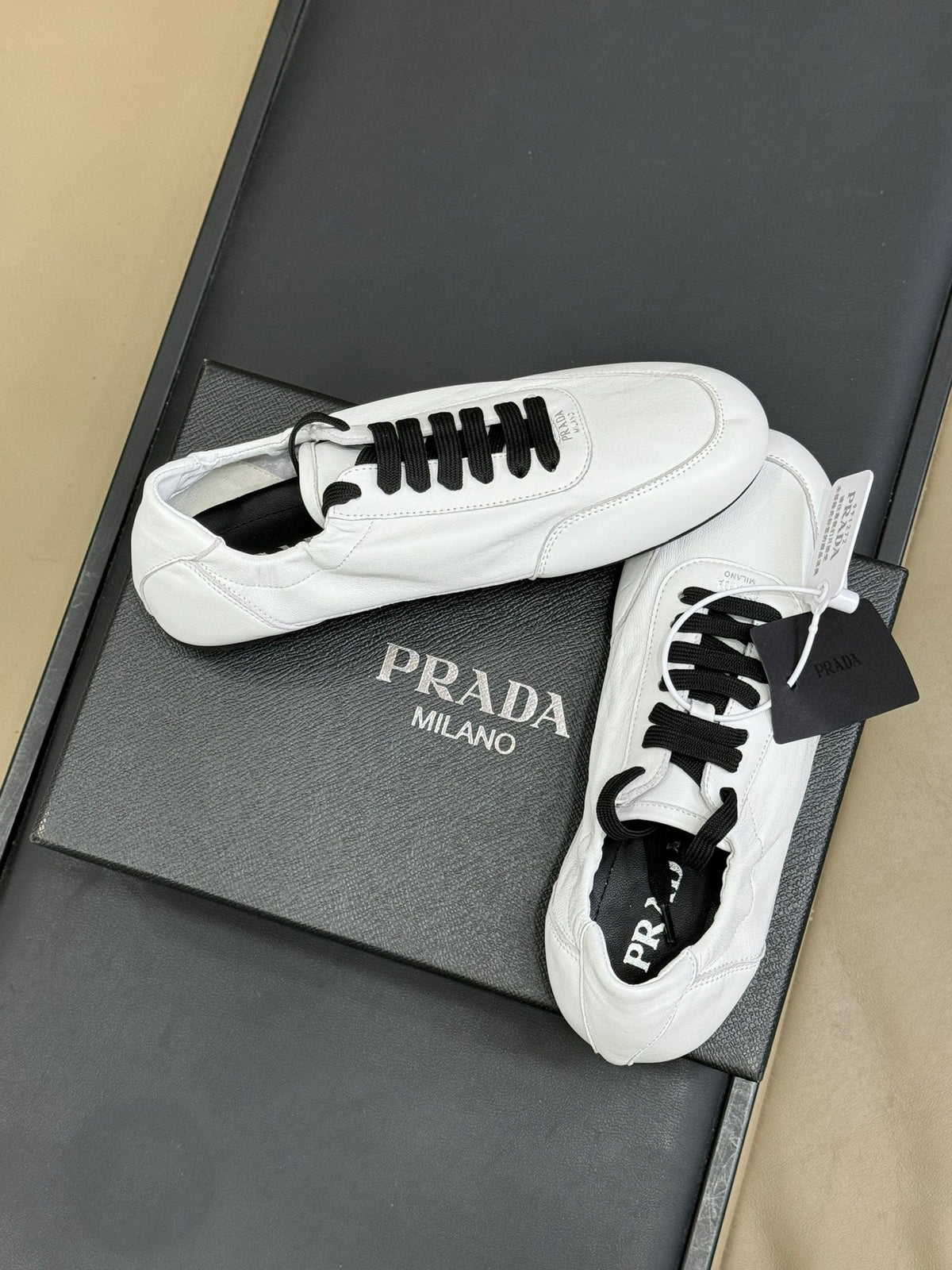 PRADA 25S COLLAPSE FLAT SHOES IN WHITE CALFSKIN